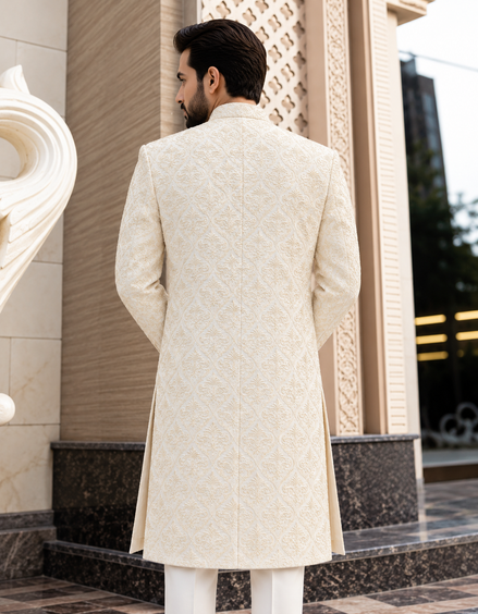 Men’s ivory embroidered sherwani with intricate damask pattern and traditional collar